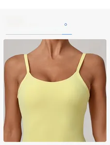 Detail of slim strap design and snug-fitting light yellow athletic yoga dress fabric