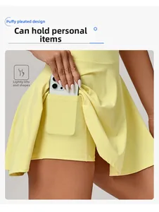 Detail view of bright yellow pleated tennis skirt with built-in pocket for smartphone