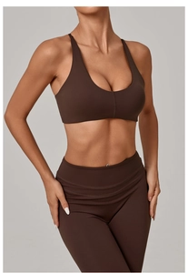 Detail view of coffee brown fitness set featuring U-neck sports bra and high-waist leggings
