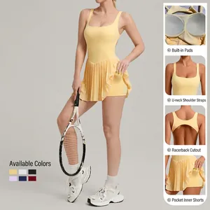 Women backless pleated tennis dress with built-in shorts and pockets in yellow