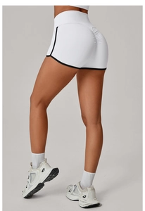 Detail of high waist yoga shorts with contrast trim and scrunch butt lifting texture