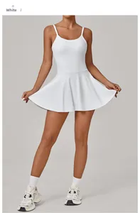 Full-body view of a white breathable tennis dress with built-in pads and A-line skirt