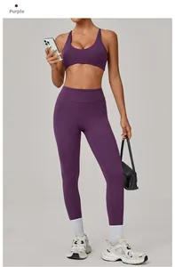 Detail of plum red yoga set showing high-waist leggings and racerback sports bra