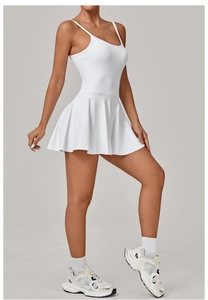 Close-up of white pleated tennis dress hem with high-stretch quick-dry athletic fabric