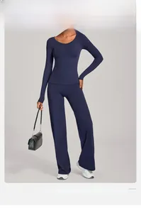 Dunkelblaues Langarm-Yoga-Set mit hochtaillierter weiter Hose und engem Sportstoff