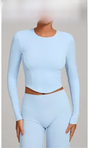 Sky blue long sleeve yoga set with high stretch fabric shown on a model in studio