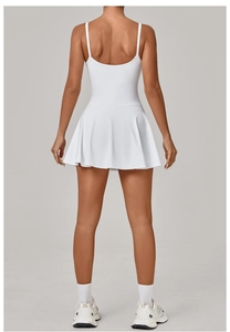 Detailed back view of white tennis dress with U-shaped open back and pleated skirt
