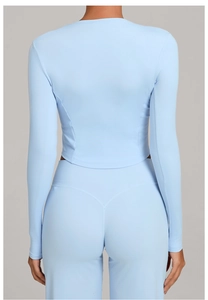 Close-up of light blue athletic set showing the seamless stitching and back view
