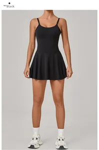 Detail of black sports dress featuring thin straps and pleated A-line skirt for tennis