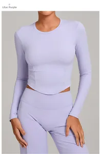 Detail of lilac purple compression yoga set showing slim fit long sleeve top and high waist leggings