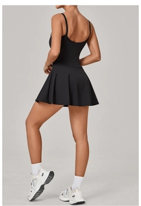 Detail of black sports dress featuring thin straps and an open back design