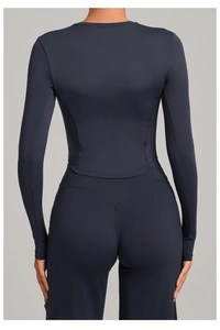 Detail view of high-waist yoga leggings with V-shaped back stitching for butt-lifting effect