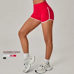 Women's high waist yoga shorts with red contrast stitching and peach butt lift effect