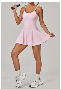 Detail showing high-stretch breathable light pink athletic dress with A-line pleated skirt