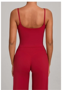 Detail view of red yoga set showing high-waist leggings and cross-back sports top back design