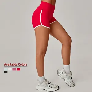 High-waisted red yoga shorts with white contrast trim for fitness and gym wear