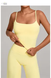 Detail showing the elastic durian yellow yoga tank top fabric stretched by hand