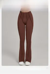Front detail of high-waist yoga flare pants with slimming triple vertical curved seams