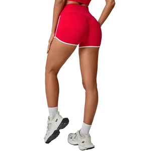 Women's red high waisted yoga shorts with white contrast trim and scrunch butt lifting detail