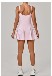 Detailed back view of pink athletic dress featuring thin straps and U-shaped open back