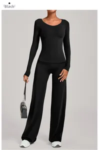 Detail von schwarzem Yoga-Oberteil und Hose mit hoher Taille für Sport und Fitness
