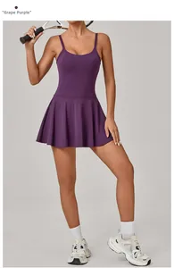 Close-up of Grape Purple athletic dress with pleated hem and tennis racket detail