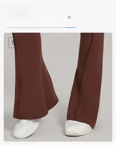 Detail view of brown flare yoga pants with slimming high waist and front seam design