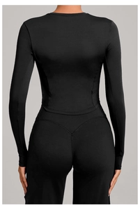 Close-up of black yoga top back design featuring V-shaped seams and high elasticity fabric