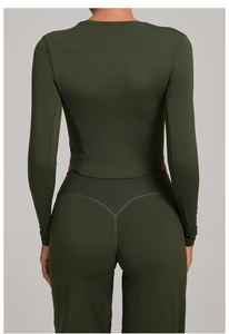 Detail view of military green sports set featuring back contouring seams and a flattering fit