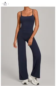Detail view of navy blue yoga set featuring high waist wide leg pants and slim fit tank top