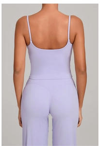 Detail view of the back of a light purple yoga set featuring a V-shaped seam and slim straps