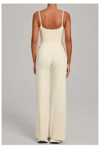 Back view of cream-colored yoga set featuring a camisole top and high-waist wide-leg pants