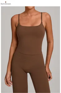 Detail view of dark brown yoga tank top with thin straps and matte compression fabric