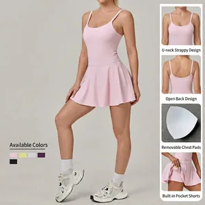 Pink athletic tennis dress with built-in shorts and removable pads for sports