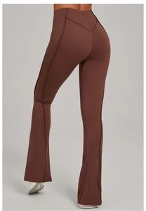 Detail of high waisted yoga flare pants with V-shaped back seam in dark coffee brown