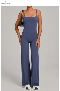 Detail shot of granite blue yoga set featuring a camisole top and high-waist flare pants