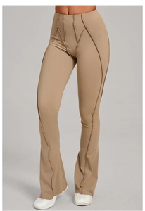 Detailed view of khaki high-waisted flare leggings with stylish exposed seams and slim fit