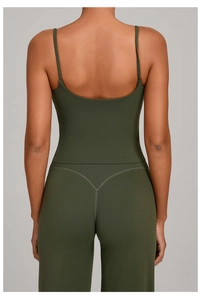 Detailed back view of olive green yoga tank top with thin straps and open U-back design