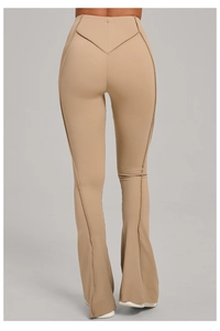 Detail view of high waist beige flare yoga pants featuring V-shaped back seam and stitch lines