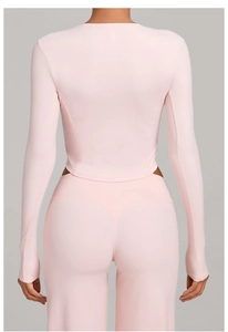 Rear view detail of high-stretch pink yoga set with sleek back seams for fitness