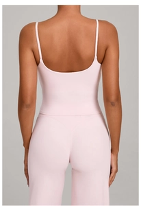 Rear view detail of pink yoga set showing thin straps tank top and high waist leggings