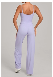 Rear view of lilac yoga set featuring a slim-fit camisole and high-waisted wide-leg pants