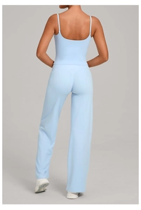 Back view of light blue yoga set featuring a backless camisole and high-waisted pants