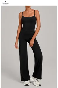 Detail of black sports set featuring a strappy camisole top and high-waisted wide-leg pants