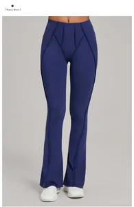 Detail of high-waisted navy blue yoga flare pants showing premium stitching and fabric