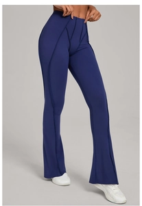 Detail view of high-waisted navy flare yoga pants with vertical slimming stitch lines