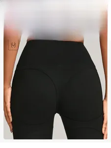Detail showing high-waist yoga pants with curved stitching to enhance hip contours