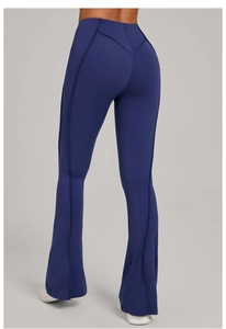 Detail of high waist flared yoga pants with V-shaped back stitching and navy blue seams