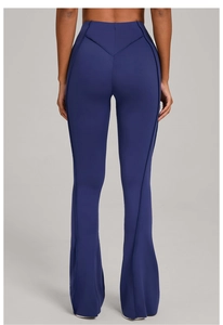 Rear view of high-waisted flared yoga pants with V-shaped stitching for a lifting effect
