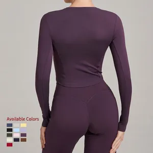 Women's purple high-impact yoga set with long sleeve top and high waist leggings